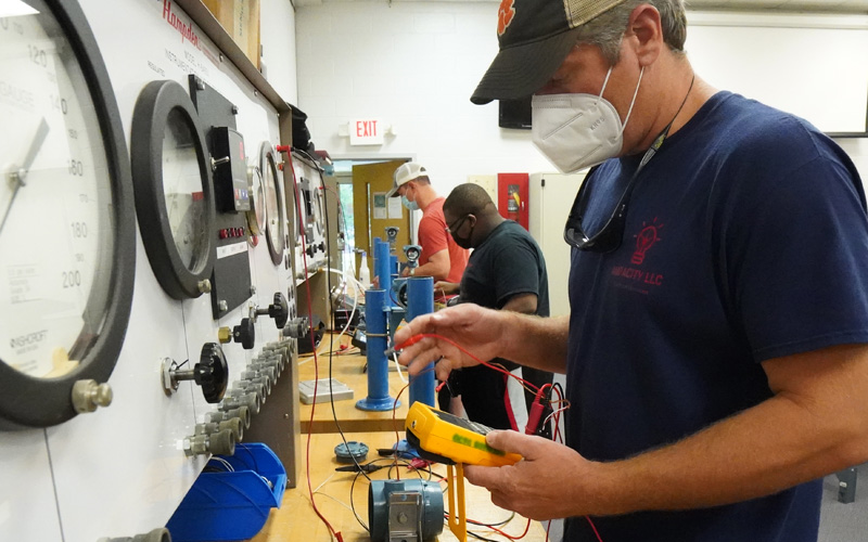EIT student with voltage meter