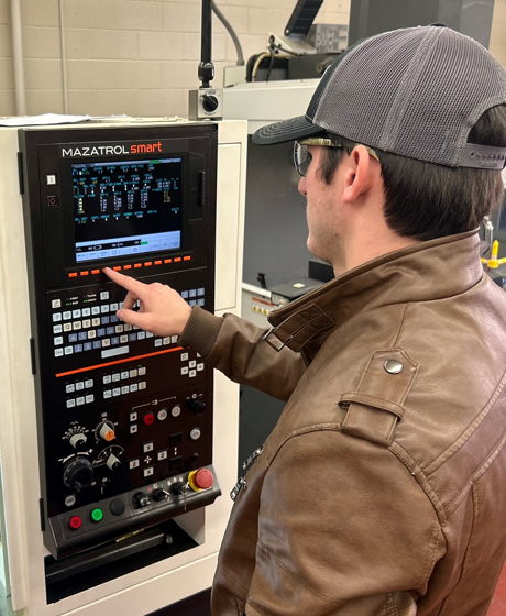Student with CNC machine