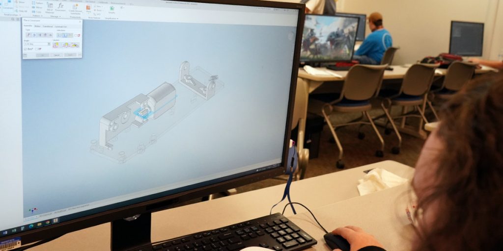 student working on CAD program on computer