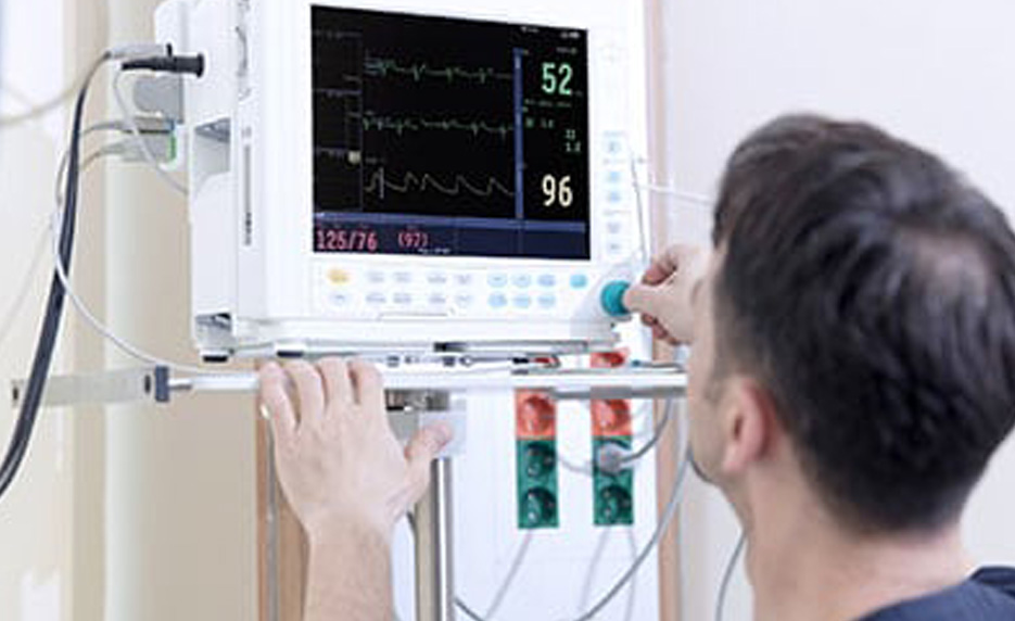 man with EKG machine