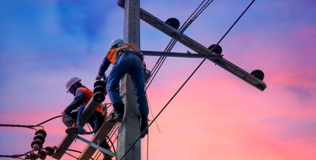 Lineman working on power pole