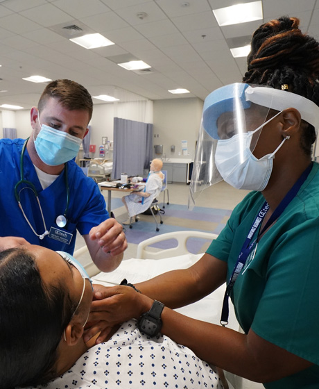 two nursing students in simulation lab