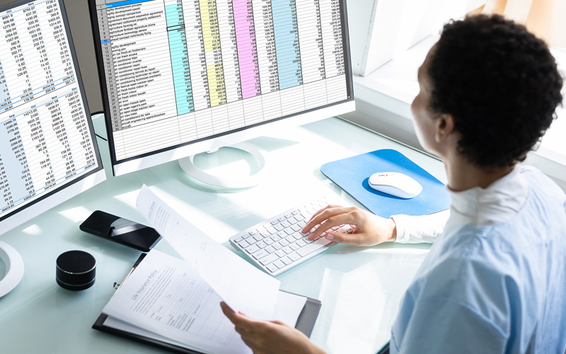 woman at desk working on computer