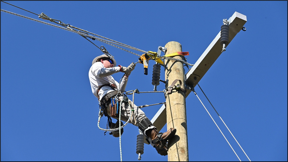Nathan Cook demonstrates his skills for prospective employers during the college’s first electrical lineman showcase.